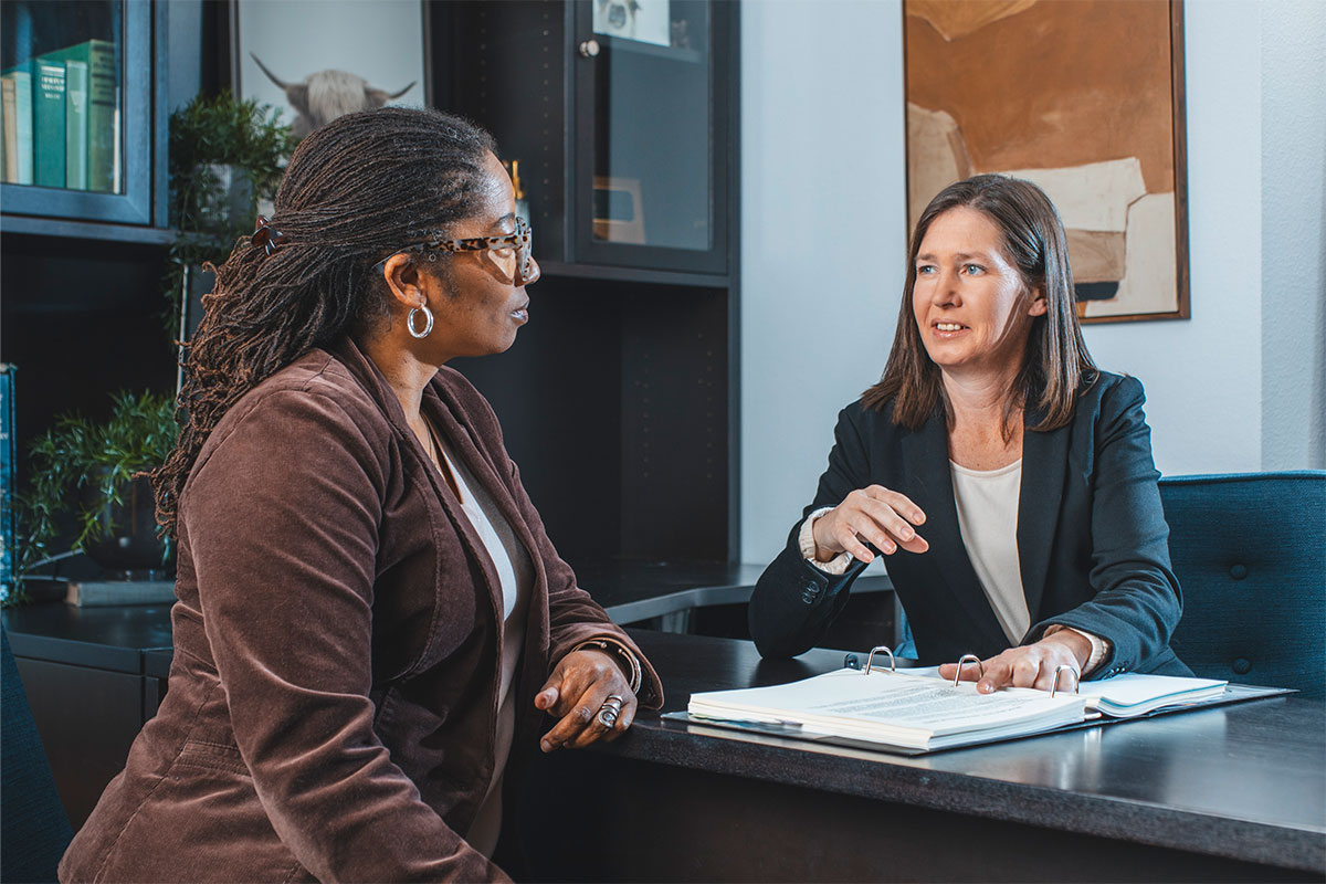 A woman is meeting with an estate tax lawyer in Rocklin and Roseville, CA at Goff Legal, PC